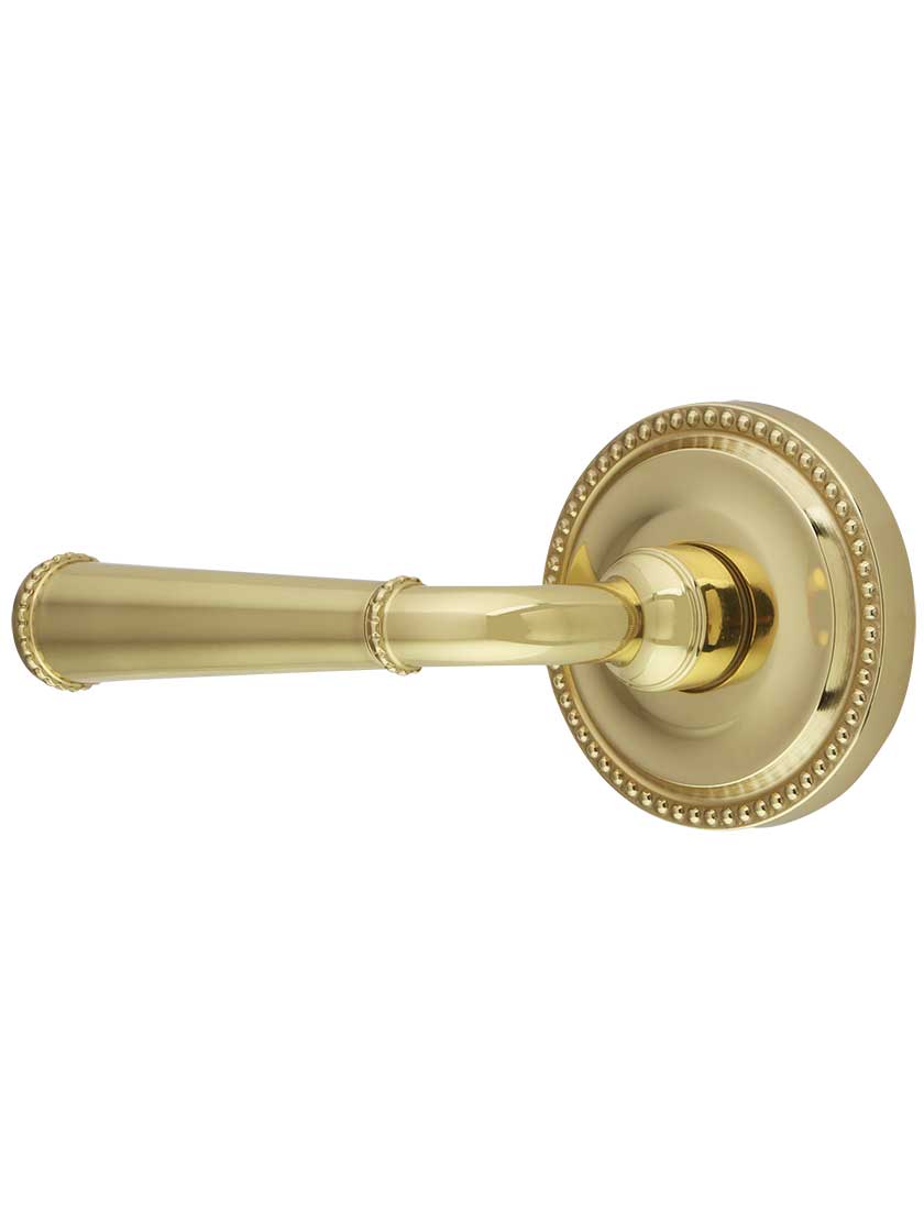 Alton Rosette Door Set with Tapered Levers in Polished Brass.